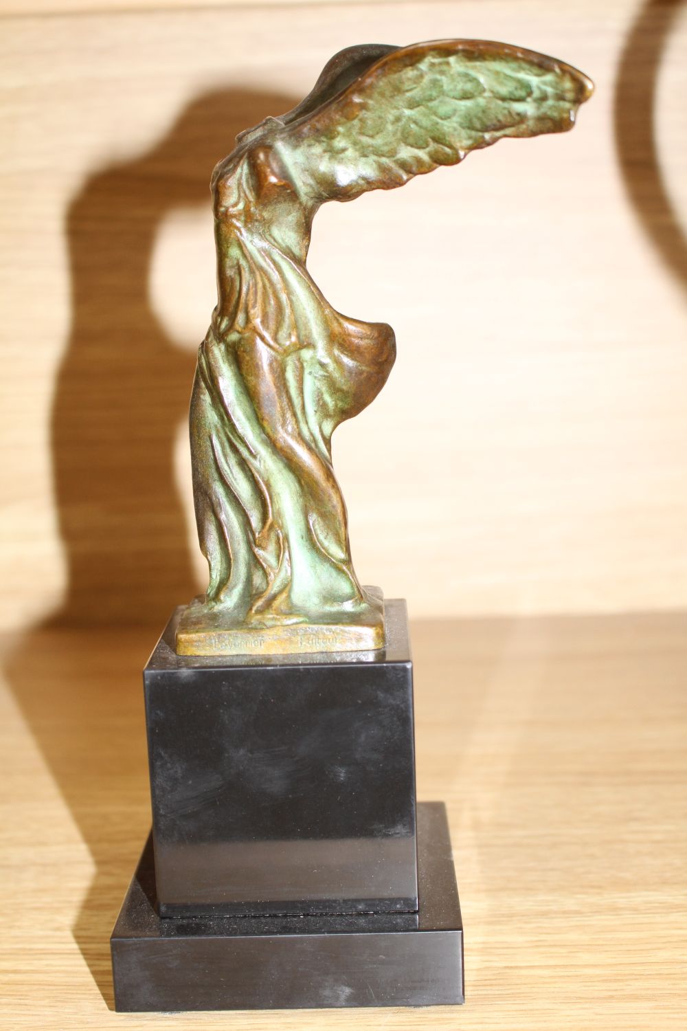 Max Le Verrier (1891-1973). A bronze group La Victoire de Samothrace, on black marble plinth, overall height 23.5cm